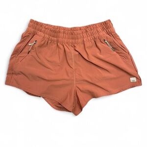 Vuori Women's Athletic Shorts in Rust